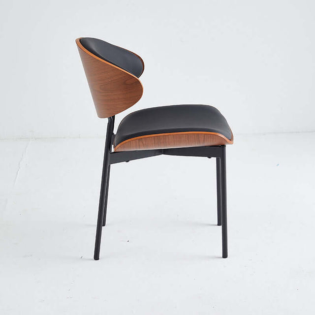 Black and wood restaurant chair with sleek design, featuring a comfortable upholstered seat and sturdy frame.