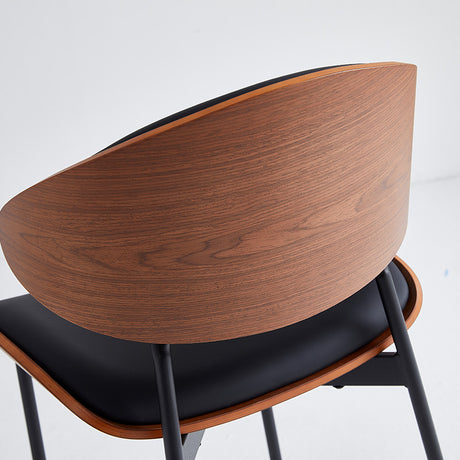 Black restaurant chair with wood grain back and padded seat, designed for durability and comfort in commercial settings.