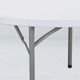 Underside view of a 60-inch round plastic folding banquet table showcasing its sturdy steel legs and lockable folding mechanism.